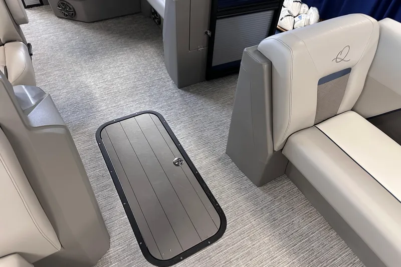 Slide: The Image of 2025 Qwest 22 Lanai E-Class TriToon interior with sleek seating and modern flooring. - 8