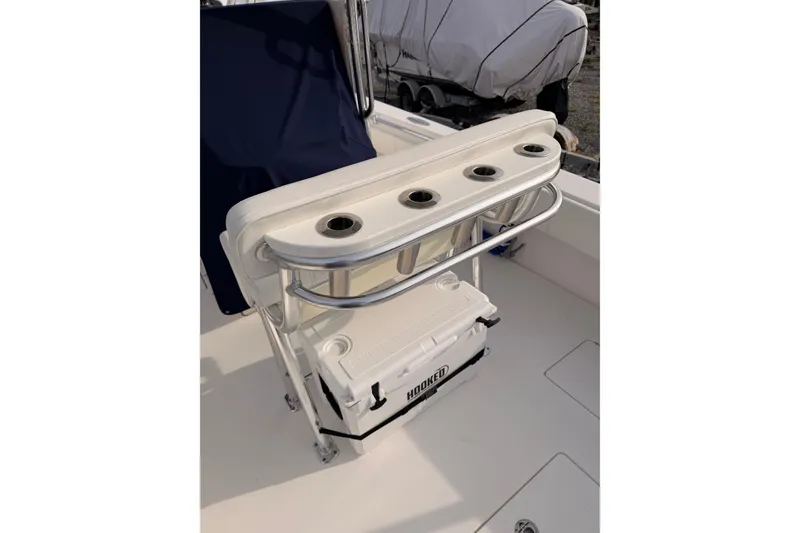 Slide: The Image of Boat seating with rod holders and cooler on Contender vessel. - 11