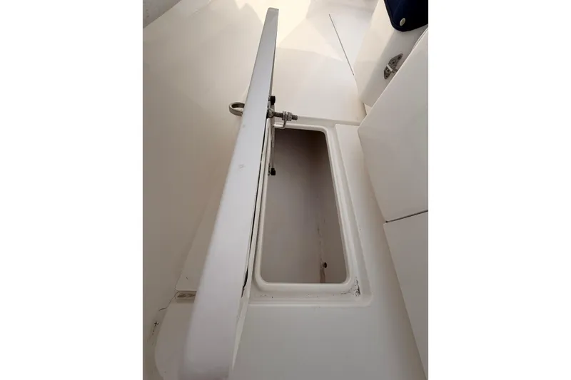 Slide: The Image of Open storage compartment on a Contender boat, showcasing interior space. - 19