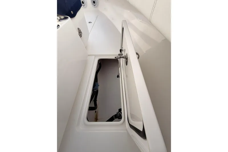 Slide: The Image of Open storage compartment on a Contender boat, showcasing interior space and design. - 21
