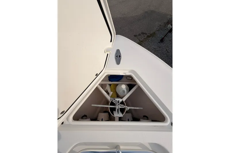 Slide: The Image of Open storage compartment on Contender boat with anchor and supplies. - 24