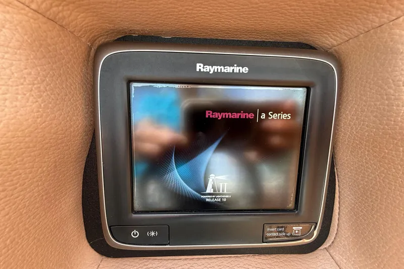 Slide: The Image of Raymarine a Series display in 2013 Cobalt 323 boat dashboard. - 13