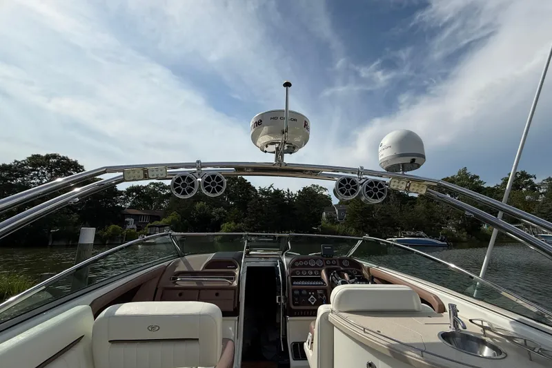 Slide: The Image of 2013 Cobalt 323 boat interior with advanced navigation equipment and luxurious seating. - 23