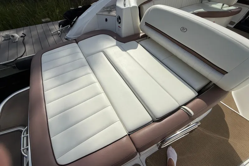 Slide: The Image of Cobalt 323 boat interior, 2013 model, featuring white and brown cushioned seating. - 25