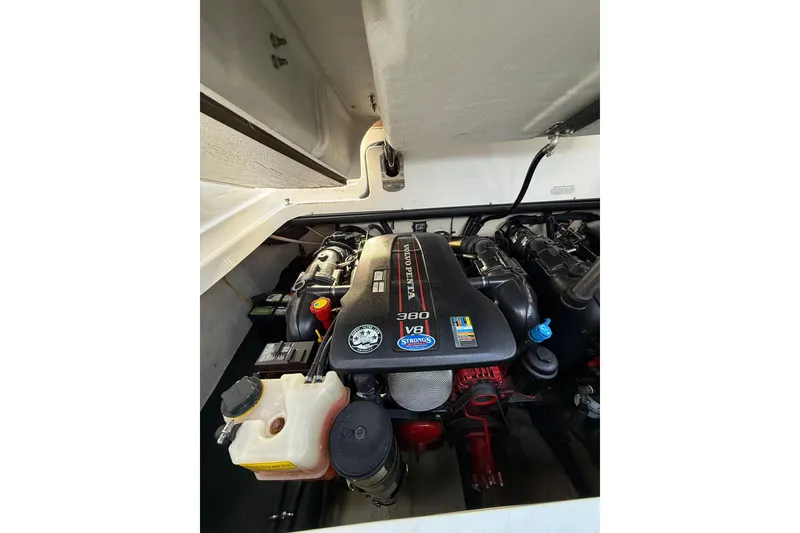 Slide: The Image of Engine compartment of a 2013 Cobalt 323 boat featuring a Volvo Penta V8 engine. - 26