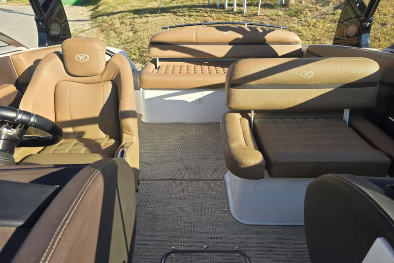 Slide: The Image of Interior of 2019 Cobalt R3 Surf boat with brown leather seating and steering wheel. - 11