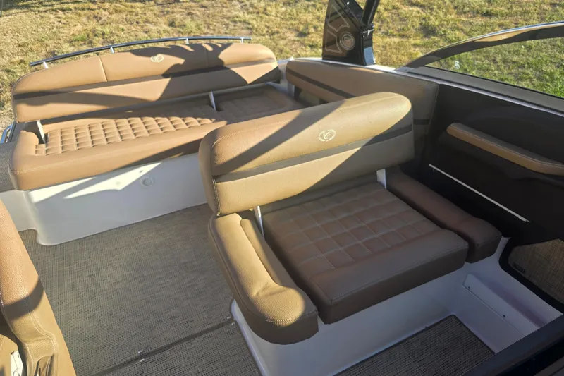 Slide: The Image of 2019 Cobalt R3 Surf boat interior with brown leather seating and carpeted flooring. - 13