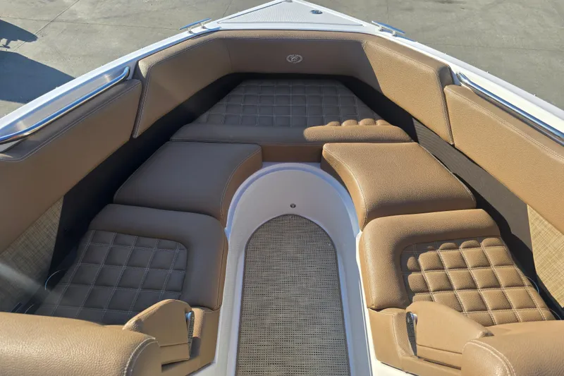 Slide: The Image of 2019 Cobalt R3 Surf boat interior with tan cushioned seating and sleek design. - 16
