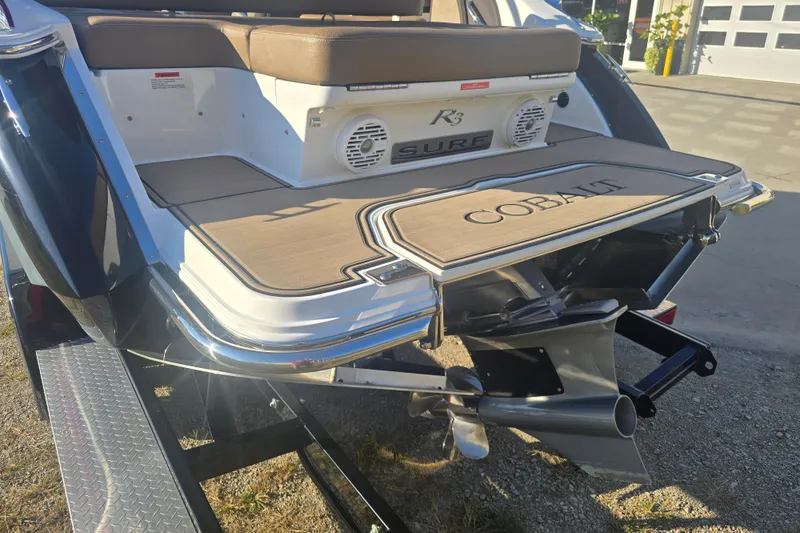 Slide: The Image of 2019 Cobalt R3 Surf boat rear view with swim platform and propeller. - 2