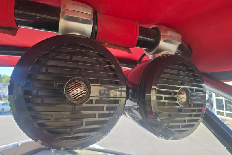 Slide: The Image of Roswell speakers on 2019 Cobalt R3 Surf boat with red canopy. - 20