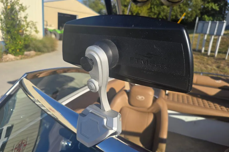 Slide: The Image of 2019 Cobalt R3 Surf boat interior with rearview mirror and tan seating. - 21