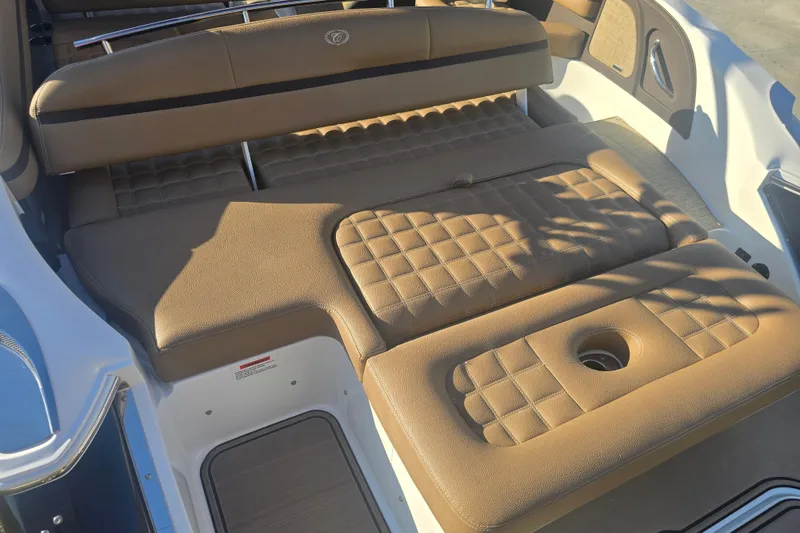 Slide: The Image of 2019 Cobalt R3 Surf boat with tan cushioned seating and stylish interior design. - 4