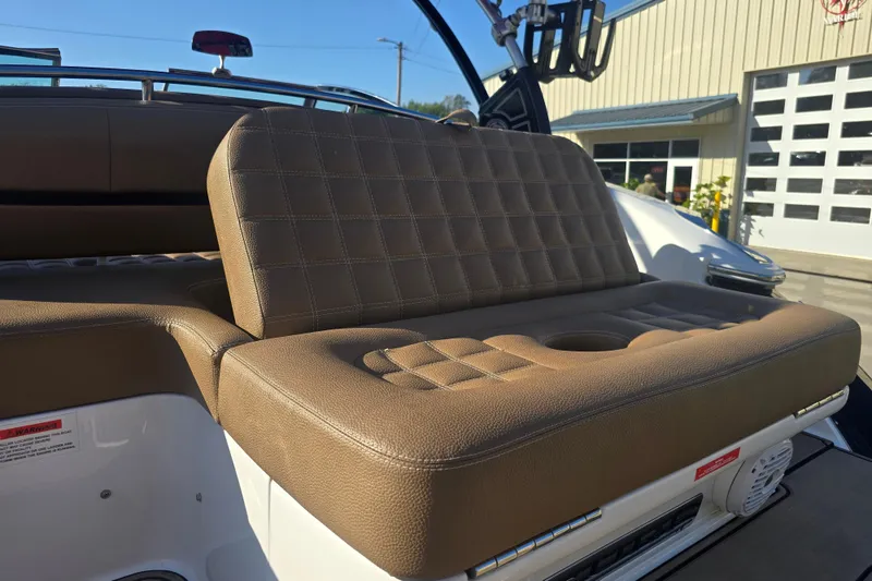 Slide: The Image of 2019 Cobalt R3 Surf boat with brown cushioned seating and cup holder. - 5
