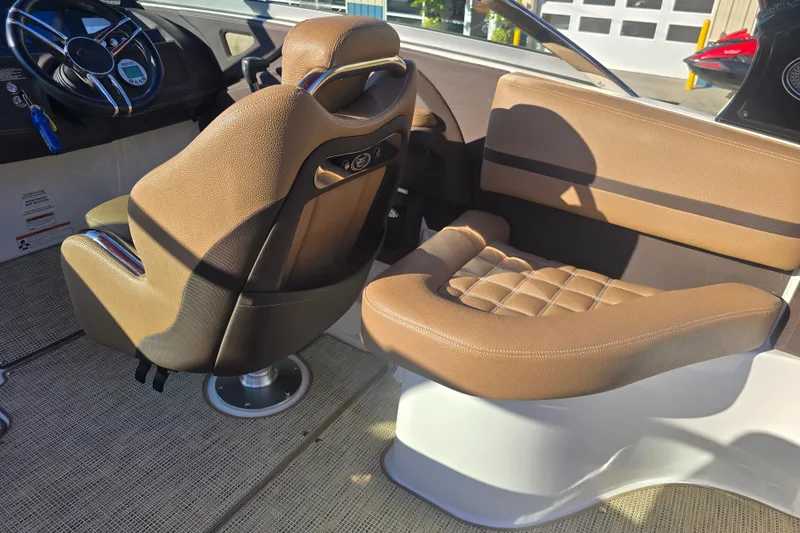Slide: The Image of 2019 Cobalt R3 Surf boat interior with brown leather seats and steering wheel. - 6