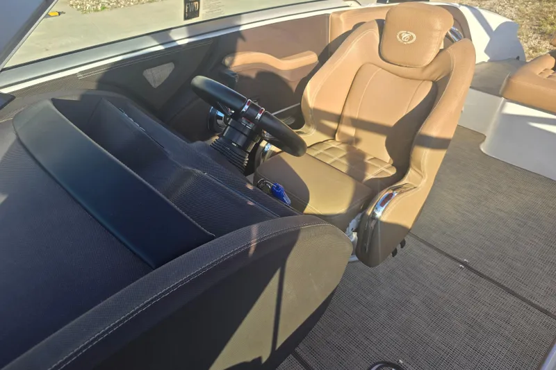 Slide: The Image of 2019 Cobalt R3 Surf boat interior with tan seating and steering wheel. - 7