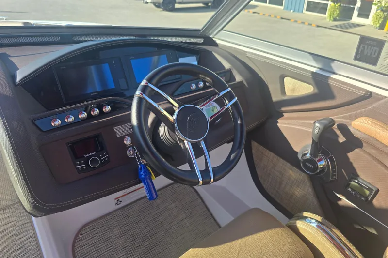 Slide: The Image of 2019 Cobalt R3 Surf boat dashboard with steering wheel and control panel. - 8
