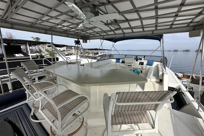 Slide: The Image of 1995 Stardust Cruisers 16x75 houseboat with spacious upper deck and seating area. - 15