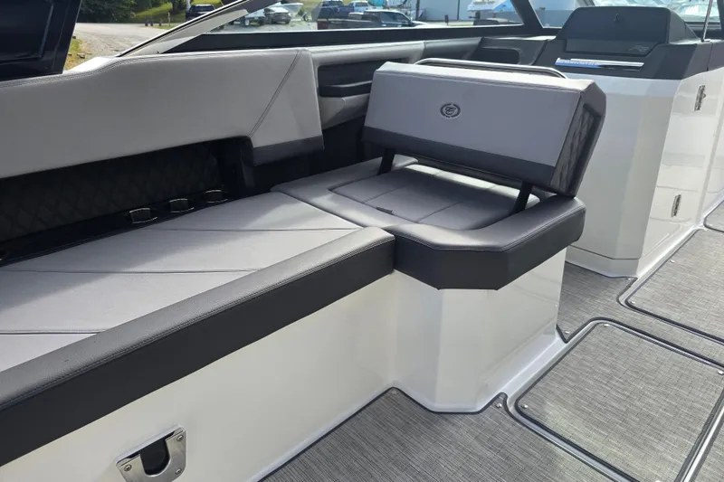 Slide: The Image of 2024 Cobalt R8 boat interior with sleek gray seating and modern design. - 10