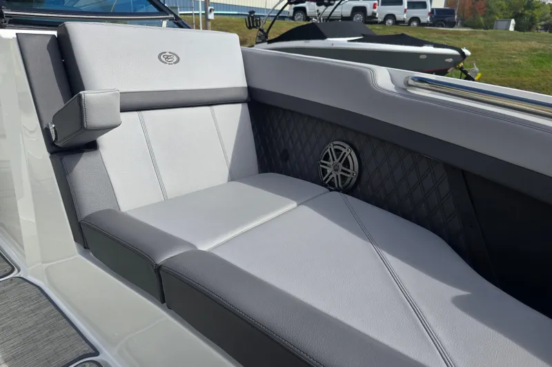 Slide: The Image of 2024 Cobalt R8 boat interior with gray seating and speaker detail. - 13