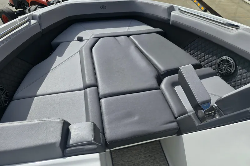 Slide: The Image of 2024 Cobalt R8 boat interior with luxurious gray seating and modern design. - 14