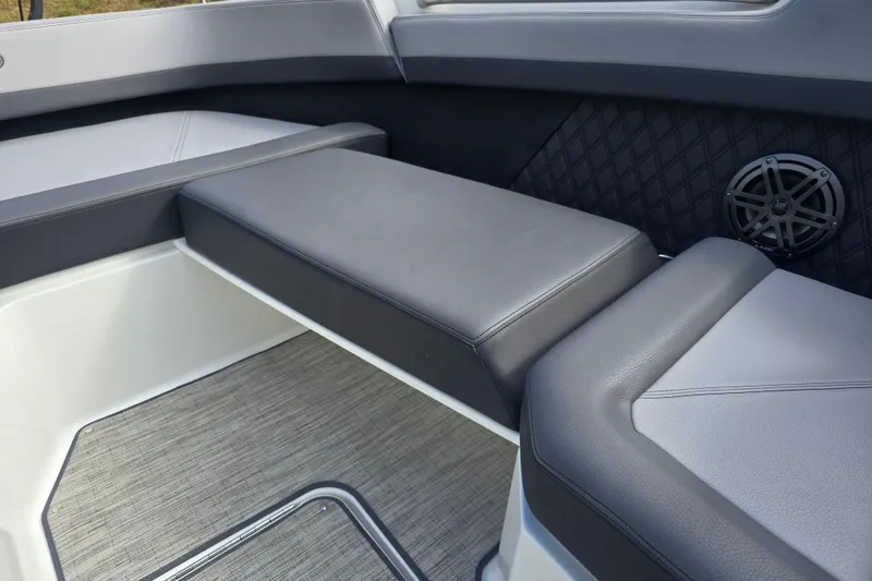 Slide: The Image of 2024 Cobalt R8 boat interior with gray seating and speaker detail. - 16