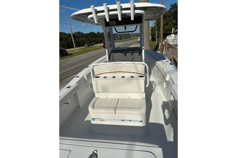 Slide: The Image of 2019 Sea Hunt Gamefish 27 boat interior with seating and rod holders. - 3
