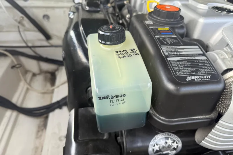 Slide: The Image of Engine compartment of a 2013 Sea Ray 300 Sundeck with Mercury MerCruiser components. - 14