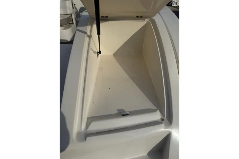 Slide: The Image of Open storage compartment on a 2013 Sea Ray 300 Sundeck boat. - 26