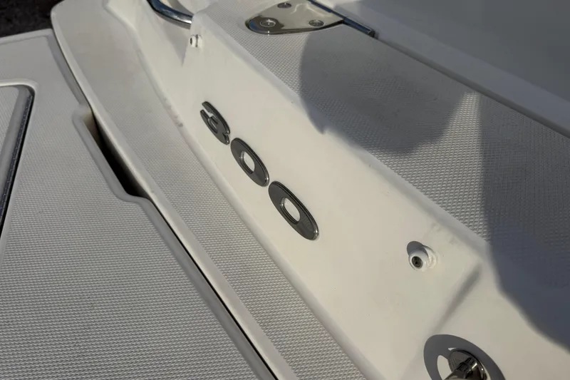 Slide: The Image of 2013 Sea Ray 300 Sundeck boat deck with model number detail. - 27