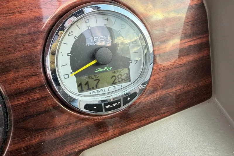 Slide: The Image of Tachometer of 2013 Sea Ray 300 Sundeck displaying 11.7 volts and 283 hours. - 3