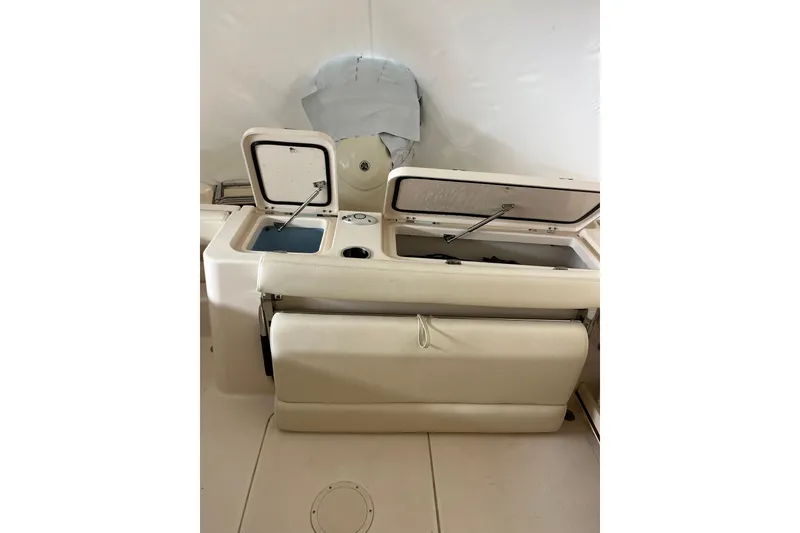 Slide: The Image of 2024 Grady-White Freedom 235 boat interior with open storage compartments. - 9