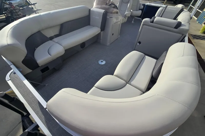Slide: The Image of 2025 Sylvan Mirage Fish 8522 Party Fish boat interior with plush seating and modern design. - 10