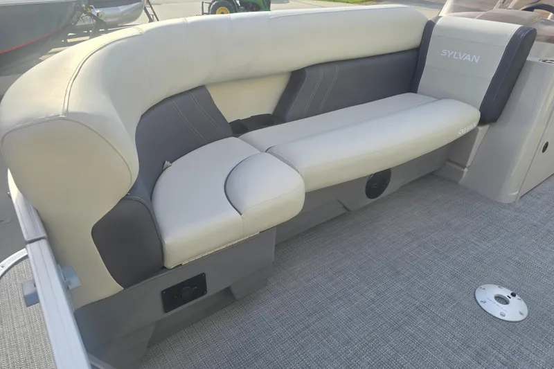 Slide: The Image of 2025 Sylvan Mirage Fish 8522 Party Fish boat interior with plush seating. - 12