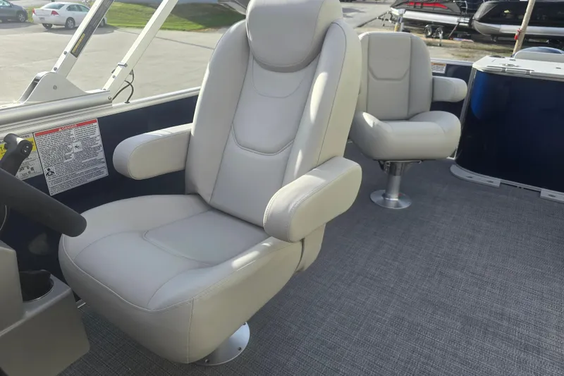 Slide: The Image of 2025 Sylvan Mirage Fish 8522 Party Fish boat interior with plush seating. - 18