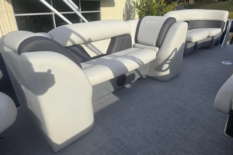 Slide: The Image of 2025 Sylvan Mirage Fish 8522 Party Fish boat interior with plush seating and modern design. - 23