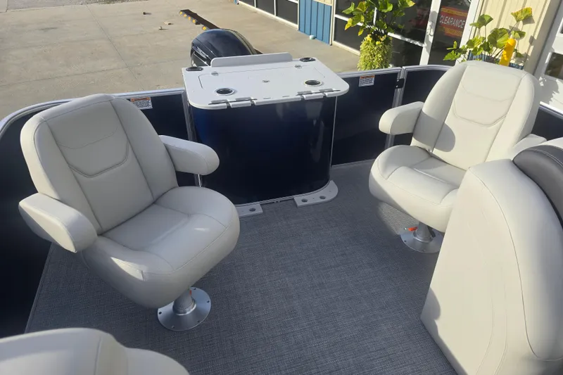 Slide: The Image of 2025 Sylvan Mirage Fish 8522 Party Fish boat interior with comfortable seating and table. - 24
