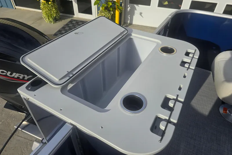 Slide: The Image of 2025 Sylvan Mirage Fish 8522 Party Fish boat with open storage compartment and cup holders. - 27