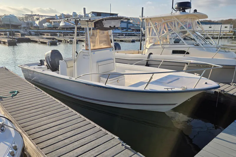 The Image of 2007 Cape Craft 22 Center Console boat docked at marina, sunny day. - 0