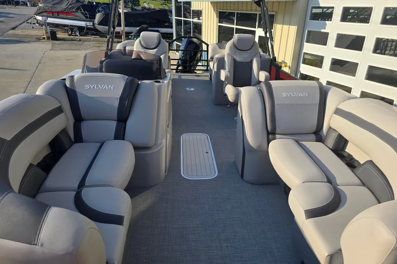 Slide: The Image of 2024 Sylvan L3 LZ pontoon boat interior with luxurious seating and modern design. - 11