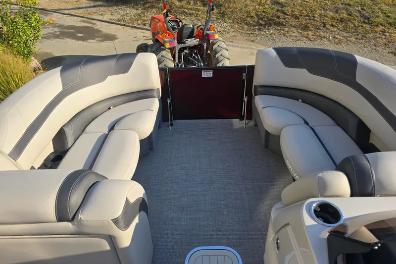 Slide: The Image of 2024 Sylvan L3 LZ pontoon boat interior with plush seating and modern design. - 13