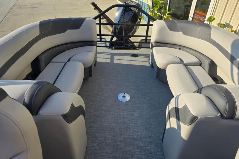 Slide: The Image of 2024 Sylvan L3 LZ pontoon boat interior with plush seating and modern design. - 21