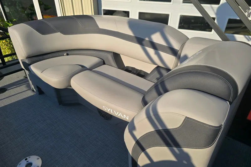 Slide: The Image of 2024 Sylvan L3 LZ boat seating with gray upholstery and modern design. - 25