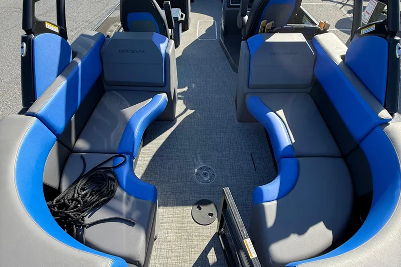 Slide: The Image of 2024 Berkshire 25RFX STS boat cockpit with steering wheel and captain's chair. - 11