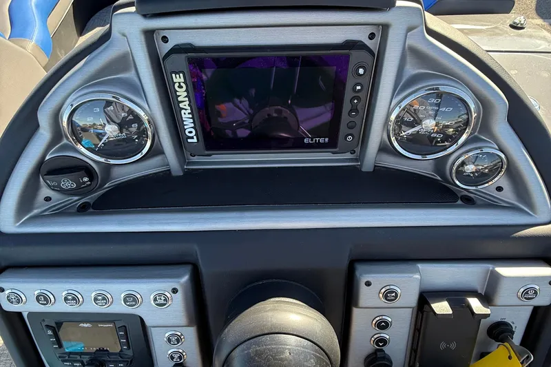 Slide: The Image of Control panel of 2024 Berkshire 25RFX STS boat with various function buttons. - 13