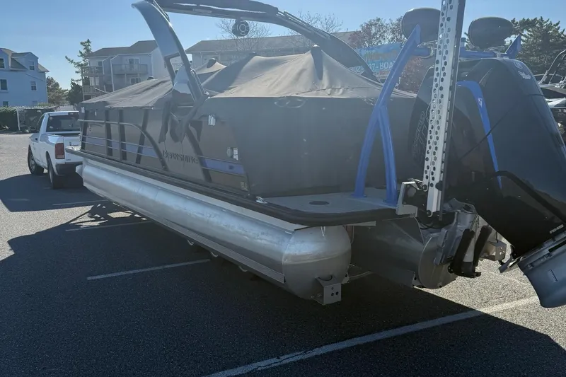 Slide: The Image of 2024 Berkshire 25RFX STS pontoon boat for sale in parking lot. - 2