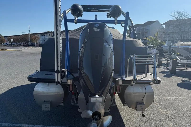 Slide: The Image of 2024 Berkshire 25RFX STS pontoon boat on trailer in parking lot. - 3