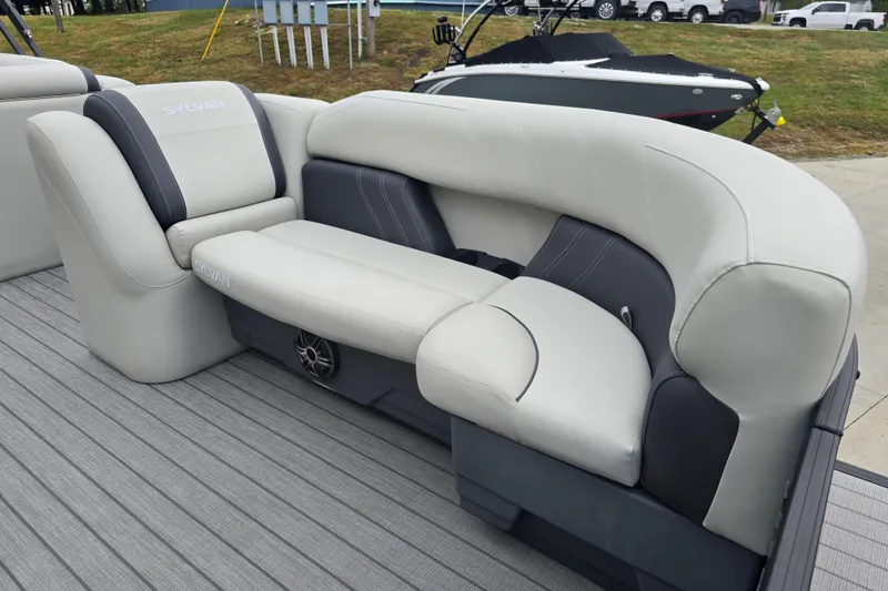 Slide: The Image of 2024 Sylvan Mirage X X5 CLZ boat interior with plush seating and modern design. - 12