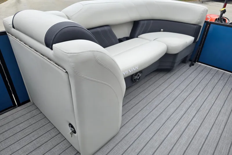 Slide: The Image of 2024 Sylvan Mirage X X5 CLZ boat interior with luxurious seating and modern design. - 13