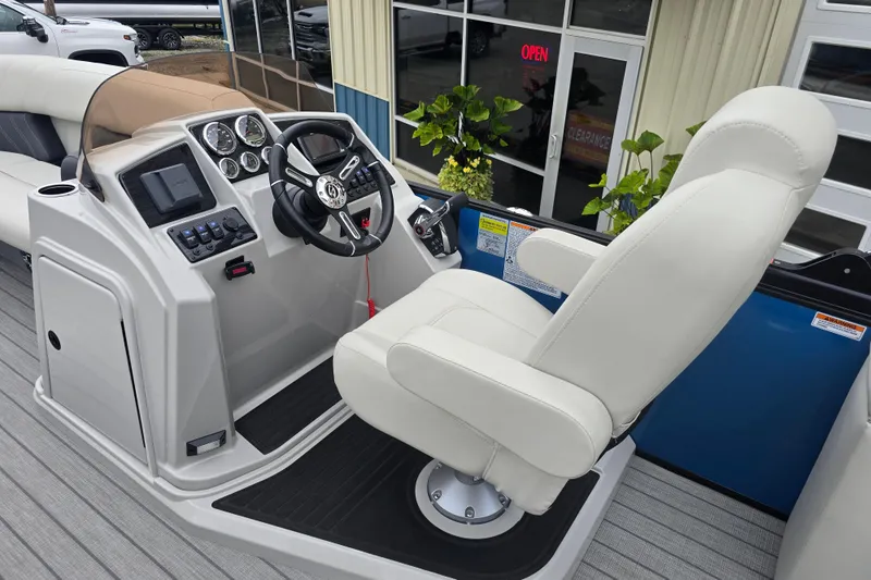 Slide: The Image of 2024 Sylvan Mirage X X5 CLZ boat helm with modern controls and comfortable captain's chair. - 16