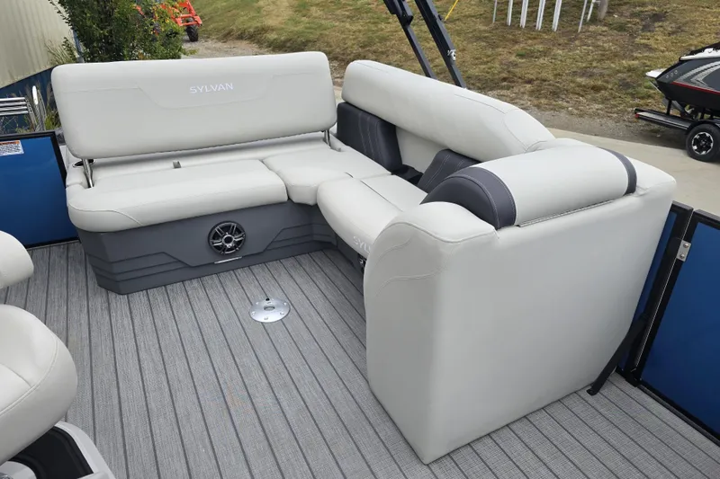 Slide: The Image of 2024 Sylvan Mirage X X5 CLZ pontoon boat interior with plush seating and modern design. - 18